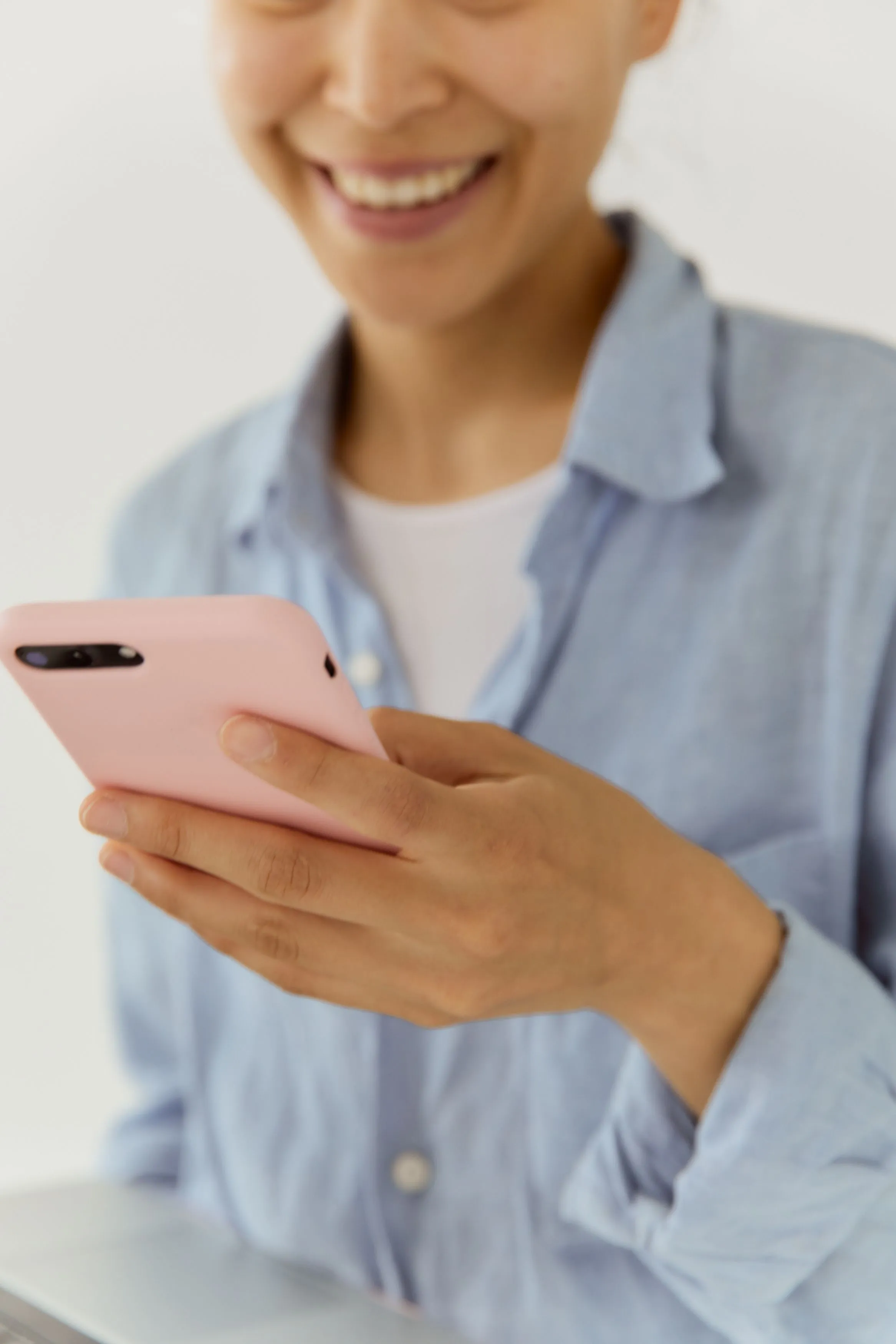 Potential patient reviewing healthcare information and follow-up messages on a smartphone